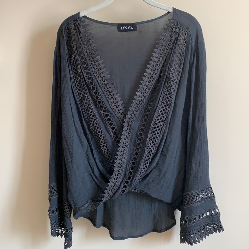 Grey shirt with bell sleeves and intricate details